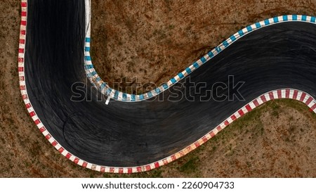 Aerial top view motorsport race asphalt circuit motor racing track, Race track, Curving race track view from above, Aerial view car race asphalt track and curve. Royalty-Free Stock Photo #2260904733