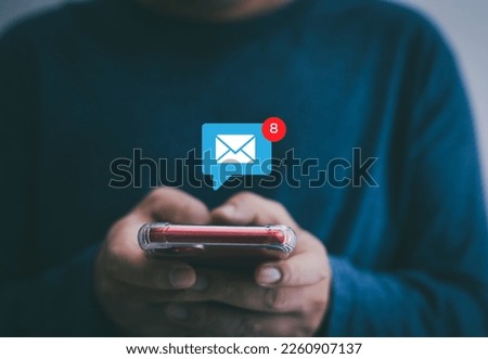 Notification concept, businessman holding smartphone touch white newsletter like e-mail Royalty-Free Stock Photo #2260907137