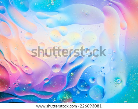 macro of oil mixed with water on colorful gradient background Royalty-Free Stock Photo #226093081