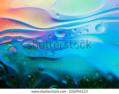 colorful abstract background with oil drops on water