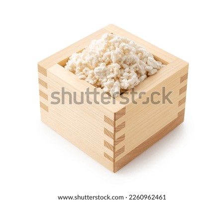 Rice koji in a box placed on a white background. Koji mold. Koji is fermented rice.  Royalty-Free Stock Photo #2260962461