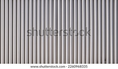 Texture of a corrugated sheet metal aluminum facade Royalty-Free Stock Photo #2260968335