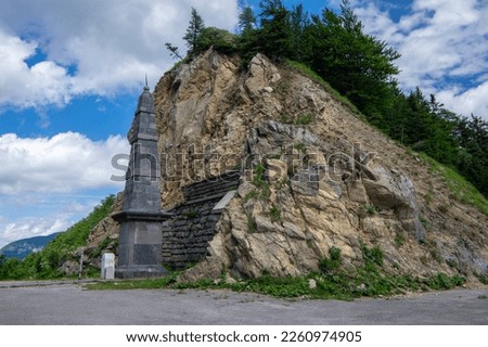 Ljubelj pass in Karawanks chain in Gorenjska region of Slovenia wihh a passageway with two tall stone obelisk on the border between Slovenia and Austria in summer time 