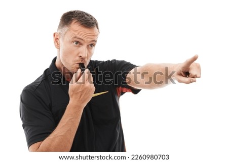 Sport, man and referee blowing whistle, pointing or gesture .in studio warning, sign or message on white background. Sports, coach and hand for rules, compliance and caution while training isolated Royalty-Free Stock Photo #2260980703