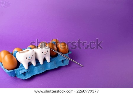 
dental concept. figurines of teeth and colorful eggs for easter.dentist's too ldentistry. Easter. dentist. teeth and dentist tools. eggs.
