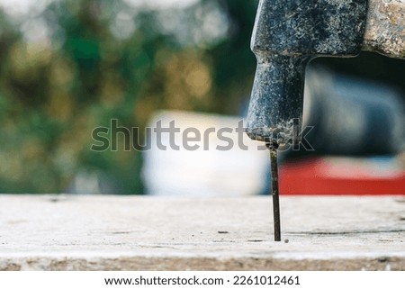 Using rusty hammer and nail on wood and blur background. Tools of wood work. Detail of a nail and a hammer. Hammer and nails on wood. copy space for text. construction concept.
