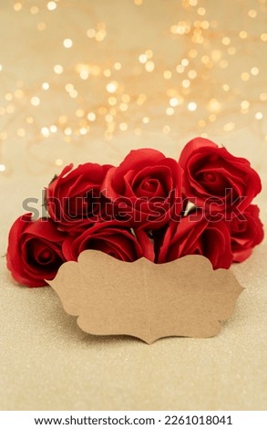 Red rose flower with empty tag, Special day greeting card concept image, Happy wedding anniversary engagement valentines day photo