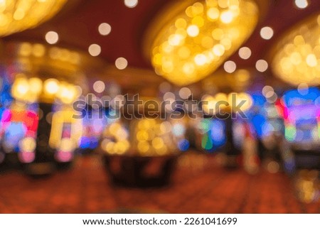 casino bokeh light abstract blur background,Blurred image of slots machines at the Casino games on a cruise ship Royalty-Free Stock Photo #2261041699