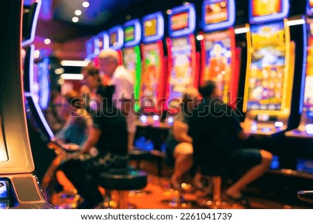 casino bokeh light abstract blur background,Blurred image of slots machines at the Casino games on a cruise ship Royalty-Free Stock Photo #2261041739
