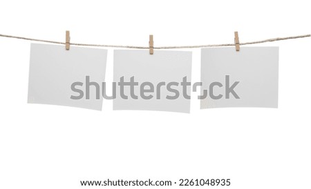 White blank cards with copy space on rope isolated on white background