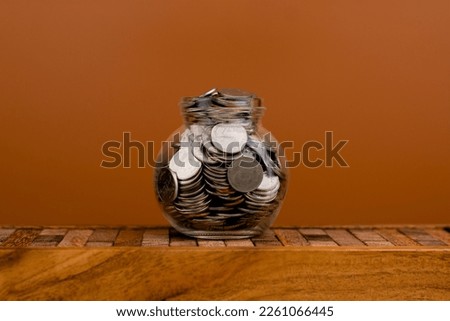 Coin money in a glass jar. Saving money. Money saving concept. coin collection