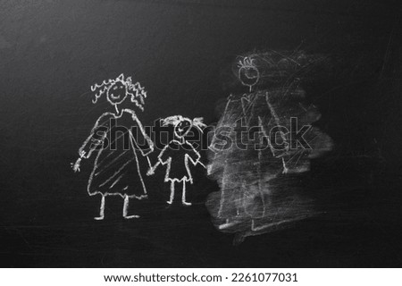 Chalk drawing of a child and parents on a blackboard, divorce concept