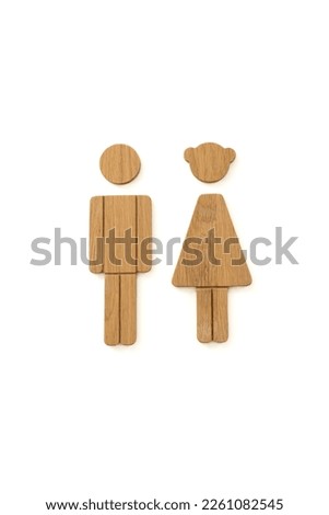 Man and Woman wooden vintage sign.Toilet sign on the whiteboard,Photography of wooden labels of man and woman icons, toilet sign, restroom icon, minimal style.toilet sign on isolated white background
