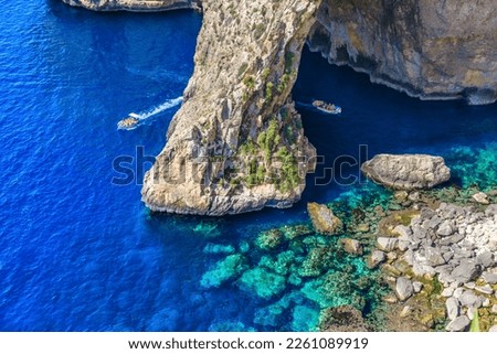 Blue Grotto in Malta.  The sea cave is located near Wied iż-Żurrieq south of Żurrieq in the southwest of the island of Malta. Royalty-Free Stock Photo #2261089919