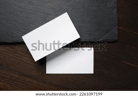 Blank white business cards. Mockup for branding identity. Template for graphic designers portfolios. Flat lay.