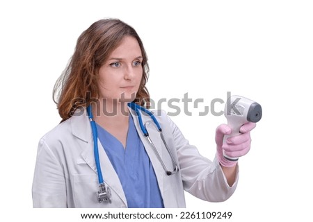 Woman doctor with electronic non-contact thermometer in white uniform, isolated on a white background. Kid aged two months