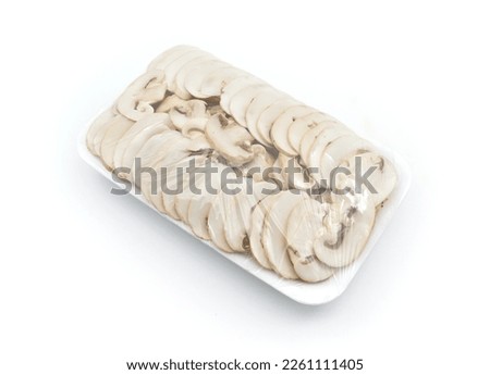 Packaged sliced mushrooms isolated on white background 