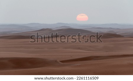 Sunsetsunrise in the empty quarter in Saudi Arabia Royalty-Free Stock Photo #2261116509