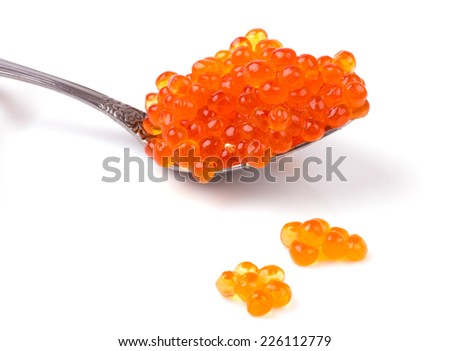 Silver spoon of red salmon caviar isolated on white background cutout