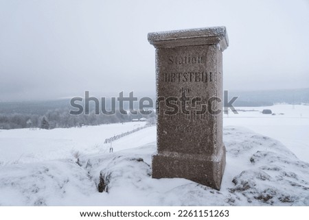 Foggy winter on Hirtstein, Satzung (Erzgebirge). Ore Mountains with snow, hoar frost and a triangulation column with german inscription reg. land survey, Translation "Station of royal triangulation"