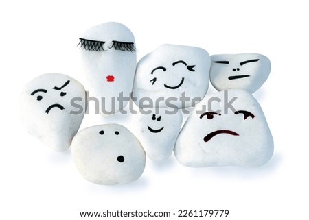 Stones with painted faces symbolize different emotions. HRM or Human Resource Management.  Learning to manage emotions. Emotion management concept.