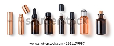 various bottles, roller bottles, spray bottles made of glass and metal for cosmetics, natural medicine , essential oils or other liquids isolated over a white background, top view	 Royalty-Free Stock Photo #2261179997