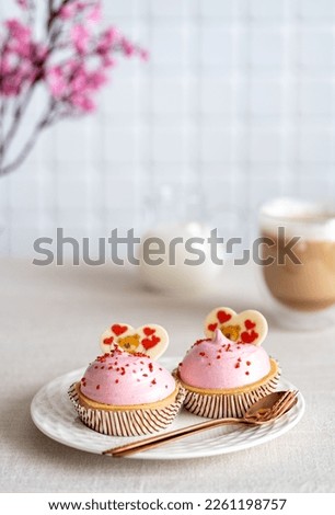 Delicious caramel Valentine's Day Cupcakes With Heart Shape and raspberry taste