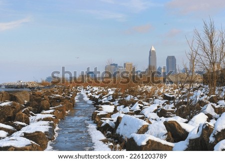 Views of Cleveland's skyline along the wintery shoreline of Lake Erie at Edgewater Park in Cleveland, Ohio.  