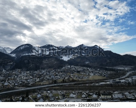 Alpine town, mountains and landscape photographed by drone