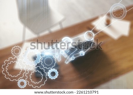 Creative abstract robotics technology hologram and modern desktop with pc on background, artificial intelligence and machine learning concept. Multi exposure