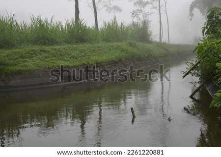 Picture of a foggy morning on a river in Indonesia