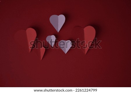 The image shows the red, pink and orange love symbols on a bright red background
