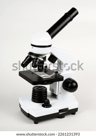 Microscope close-up. Examination of a micro sample on a glass slide. Animation for use in science and medicine.