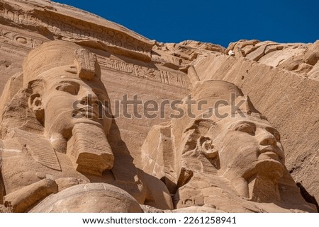 Ramses II statue in front of Abu Simbel Temple in Egypt Royalty-Free Stock Photo #2261258941