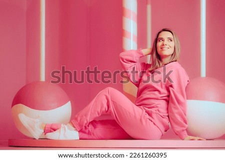 
Happy Woman Wearing Pink Sitting in a Candy Carrousel Décor. Happy cheerful girl having a sweet tooth enjoying dessert
 Royalty-Free Stock Photo #2261260395