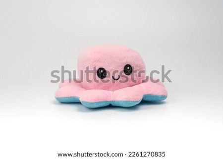 Octopus reversible mood toy. Pink Color side Happy face. Plush toys for kids. Royalty-Free Stock Photo #2261270835
