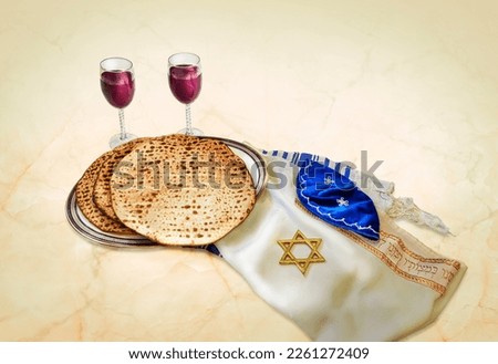 Passover with wine and matzah on table.
Translation: Blessed are you, Lord our G‑d, King of the universe, Who has sanctified us with His commandments, and commanded us to enwrap ourselves with shawl. Royalty-Free Stock Photo #2261272409