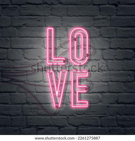 Composition made of Flat lay ultraviolet neon colors. Retro Neon inscription of Love banner 80's.Neon inscription of "LOVE" on brick wall .Minimal concept of  love.Creative art,minimal aesthetics.