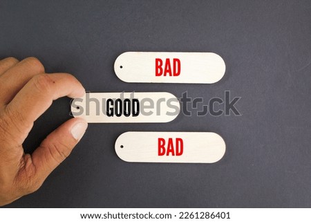 hand choose good words among bad words. the concept of good and bad behavior. customer review concept Royalty-Free Stock Photo #2261286401