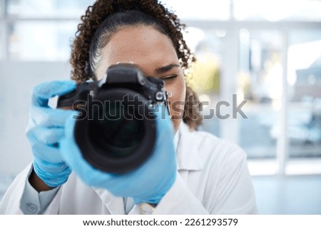 Camera, medical and forensics with black woman in laboratory for investigation, crime scene and photography evidence. Research, analytics and observation with girl and digital pictures for science