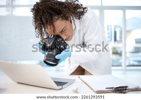 Medical investigation, camera and black woman with laptop in laboratory for forensic research with evidence. Photography, science and girl take picture for crime analysis, analytics and observation