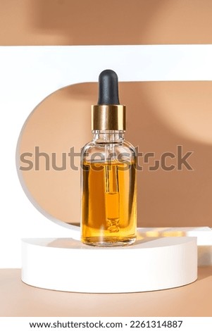 Beauty face oil in a glass dropper bottle in Arch. Trendy shoot of cosmetics packaging. Essential oil with natural ingredients. Cruelty free cosmetics Royalty-Free Stock Photo #2261314887