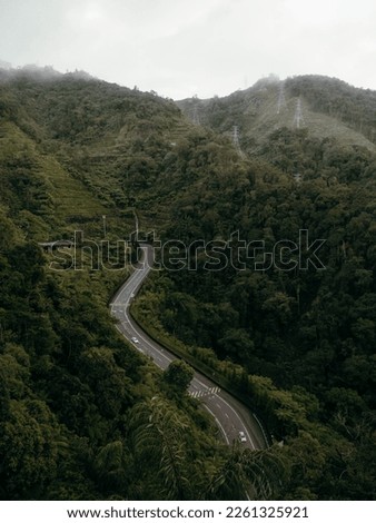 Genting Highlands is a popular tourist destination located in Malaysia. It is known for its scenic views, lush greenery, and exciting entertainment options. A moody pictures with a thick fog and cloud