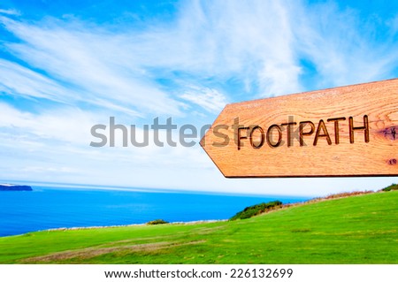 Footpath direction sign in English countryside