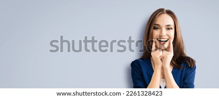 Dental health care concept picture - happy excited beautiful woman in blue cloth show white toothy smile. Portrait image of brunette girl, isolate over grey gray background, wide banner ad copy space.