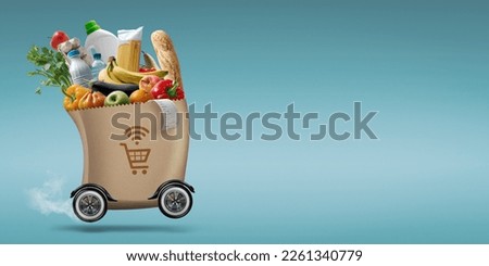 Automated grocery bag on wheels, online grocery shopping and delivery concept Royalty-Free Stock Photo #2261340779