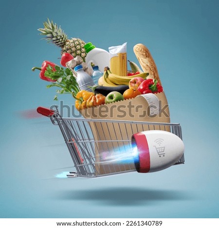 Fast rocket-propelled shopping cart flying and delivering fresh groceries, online grocery shopping and express delivery concept Royalty-Free Stock Photo #2261340789