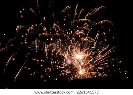 Colourful Pattern of Fireworks at night sky black background isolated copy space Royalty-Free Stock Photo #2261341573