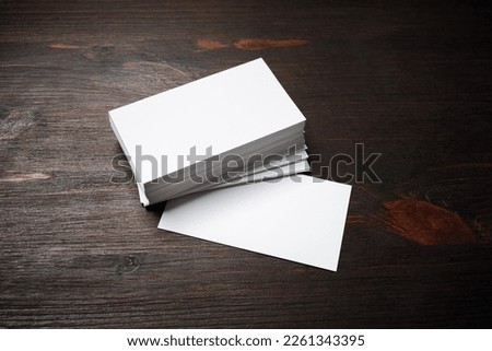 Blank business cards on wood table background. Mockup for ID. Template for graphic designers portfolios.