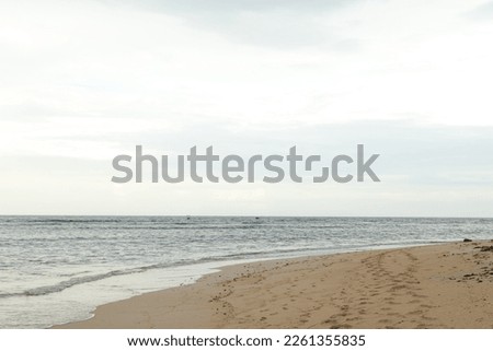 Lombok and Gili Air islands, overcast, cloudy day, sky and sea. Vacation, travel, tropics concept, no people. Sunset, sand beach. Royalty-Free Stock Photo #2261355835